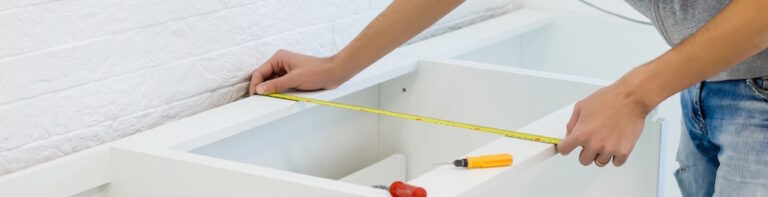 kitchen remodeler measuring cabinets