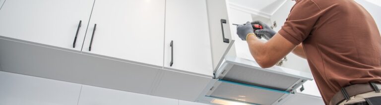 Contractor Worker Assembling of New Kitchen Cabinets